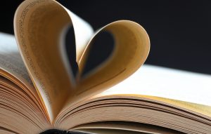 pages of a book curved into a heart